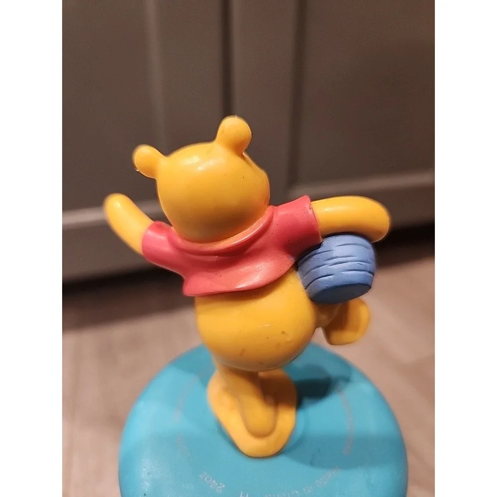 Winnie the pooh standing on one leg holding‎ honey pot plastic toy Cake Topper